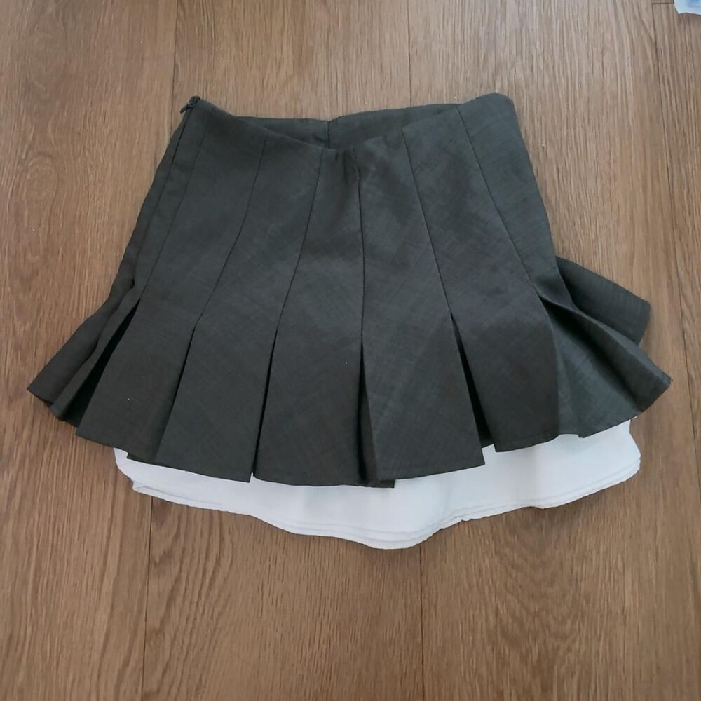 Gray pleated mini skirt with white ruffle hem
